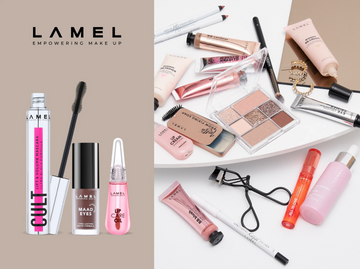 Various makeup products including foundation, powder, eyeshadow palette, brush, and lip gloss on a black surface.